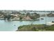 Aerial view of waterfront homes and boats on a sunny day at 100 Bluff View Dr # 605A, Belleair Bluffs, FL 33770