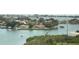Aerial view of waterfront homes and boats on a sunny day at 100 Bluff View Dr # 605A, Belleair Bluffs, FL 33770