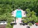 Resort-style pool with lounge chairs and shaded areas at 19300 Lonesome Pine Dr, Land O Lakes, FL 34638