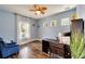 Home office featuring wood flooring and a desk at 19300 Lonesome Pine Dr, Land O Lakes, FL 34638