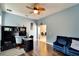 Bright home office with built-in shelving and comfortable seating at 19300 Lonesome Pine Dr, Land O Lakes, FL 34638