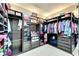 Large walk-in closet with ample shelving and hanging space at 19300 Lonesome Pine Dr, Land O Lakes, FL 34638