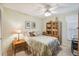 Cozy bedroom with double bed, ceiling fan, and built-in shelving at 4137 Edgewood Dr, Holiday, FL 34691