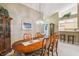 Dining room with large table and view into living room at 4137 Edgewood Dr, Holiday, FL 34691