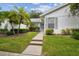 Inviting exterior with landscaped grounds and walkway at 4137 Edgewood Dr, Holiday, FL 34691