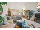 Open living room with sectional sofa and view to dining area at 4137 Edgewood Dr, Holiday, FL 34691