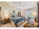 Cozy bedroom with double bed, dresser, and ceiling fan at 4137 Edgewood Dr, Holiday, FL 34691