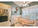 Charming dining area features a light wood table and four chairs at 4137 Edgewood Dr, Holiday, FL 34691