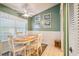 Bright dining area with wood table, four chairs, and decorative rug at 4137 Edgewood Dr, Holiday, FL 34691