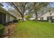 Neatly landscaped community with lush green grass and mature trees at 4137 Edgewood Dr, Holiday, FL 34691