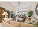 Spacious living room with sectional sofa and access to patio at 4137 Edgewood Dr, Holiday, FL 34691