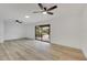 Light and bright living room with wood floors and sliding glass door at 1722 Castle Rock Rd, Tampa, FL 33612