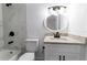 Bright bathroom with a white vanity, granite countertops, and modern fixtures, including black faucet and shower hardware at 3432 Danny Bryan Blvd, Tampa, FL 33619