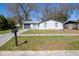 Charming single-story home features a well-maintained front yard and attached garage at 3432 Danny Bryan Blvd, Tampa, FL 33619