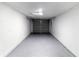 Clean and spacious garage with painted walls, flooring, and an insulated garage door, ready for parking and storage at 3432 Danny Bryan Blvd, Tampa, FL 33619