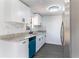 Renovated kitchen featuring granite countertops, new white cabinets, stainless steel refrigerator and blue dishwasher at 3432 Danny Bryan Blvd, Tampa, FL 33619