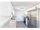 Bright kitchen featuring white cabinets, stainless steel appliances, and stone countertops at 3432 Danny Bryan Blvd, Tampa, FL 33619