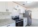 Modern kitchen with stainless steel appliances and white backsplash at 3432 Danny Bryan Blvd, Tampa, FL 33619