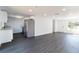 Open-concept living space with recessed lights, new flooring, and updated kitchen with granite countertops at 3432 Danny Bryan Blvd, Tampa, FL 33619