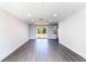 Spacious living room with recessed lighting, new flooring, with access to the kitchen and sliding glass doors at 3432 Danny Bryan Blvd, Tampa, FL 33619