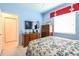 Light and airy bedroom with a dresser and walk-in closet at 16252 Amethyst Key Dr, Wimauma, FL 33598
