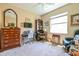 Bright home office features built-in shelving and a large window at 16252 Amethyst Key Dr, Wimauma, FL 33598