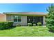 Screened patio and well-manicured lawn in backyard at 16252 Amethyst Key Dr, Wimauma, FL 33598