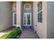 Front entry with double doors and a brick walkway at 16252 Amethyst Key Dr, Wimauma, FL 33598