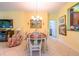 Bright dining room with a table and chairs, ready for Gathering meals at 16252 Amethyst Key Dr, Wimauma, FL 33598