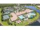 Aerial view showing community center, tennis courts and lake at 16252 Amethyst Key Dr, Wimauma, FL 33598