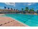 Resort-style pool with multiple lap lanes and lounge chairs at 16252 Amethyst Key Dr, Wimauma, FL 33598