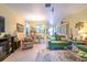 Bright and airy living room with comfortable seating and a view to the dining area at 16252 Amethyst Key Dr, Wimauma, FL 33598