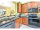 Kitchen with granite countertops and stainless steel appliances at 16252 Amethyst Key Dr, Wimauma, FL 33598