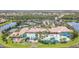 Aerial view of community clubhouse with pool and tennis courts at 16252 Amethyst Key Dr, Wimauma, FL 33598