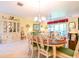 Elegant dining room featuring a formal table setting and built-in hutch at 16252 Amethyst Key Dr, Wimauma, FL 33598