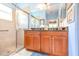 Bathroom with double vanity and walk-in shower at 16252 Amethyst Key Dr, Wimauma, FL 33598