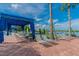 Relaxing poolside lounge area with cabanas and comfortable seating at 16252 Amethyst Key Dr, Wimauma, FL 33598