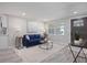 Living room boasts a comfortable couch, coffee table, and a stylish rug at 2624 Society Dr, Holiday, FL 34691