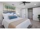 Comfortable bedroom with a queen-size bed, ceiling fan, and plenty of closet space at 2624 Society Dr, Holiday, FL 34691