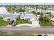 Attractive waterfront home with a large driveway and yard at 2624 Society Dr, Holiday, FL 34691