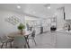 Bright kitchen features white shaker cabinets, stainless steel appliances, and quartz countertops at 2624 Society Dr, Holiday, FL 34691
