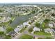 Birds-eye view of waterfront community with lush green spaces at 2624 Society Dr, Holiday, FL 34691