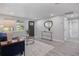 Spacious living room with neutral walls, hardwood floors, and ample natural light at 2624 Society Dr, Holiday, FL 34691
