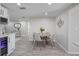 Cozy dining area with a round table and four chairs, perfect for intimate meals at 2624 Society Dr, Holiday, FL 34691