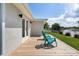 Relaxing waterfront deck with teal chairs and beautiful views at 2624 Society Dr, Holiday, FL 34691