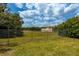 Open grassy area behind the property at 4902 N Habana Ave, Tampa, FL 33614