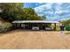 Covered carport with gravel parking area at 4902 N Habana Ave, Tampa, FL 33614