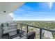 Relaxing outdoor seating area with a stunning treetop view for a serene escape at 2910 W Barcelona St # 903, Tampa, FL 33629