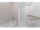Chic bathroom features a bathtub, stylish tiling, modern vanity, and tile floors at 2910 W Barcelona St # 903, Tampa, FL 33629