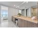 Bathroom features a large vanity, sink, and adjacent bedroom view at 2910 W Barcelona St # 903, Tampa, FL 33629